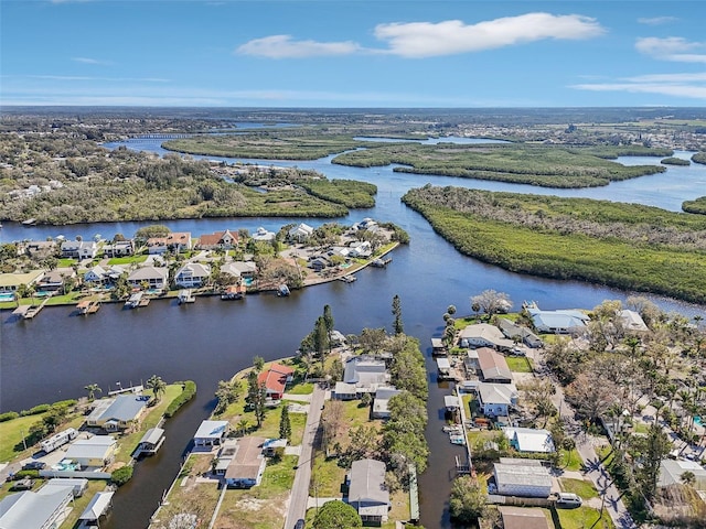 drone / aerial view with a water view and a residential view