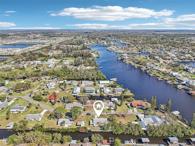 birds eye view of property featuring a water view and a residential view