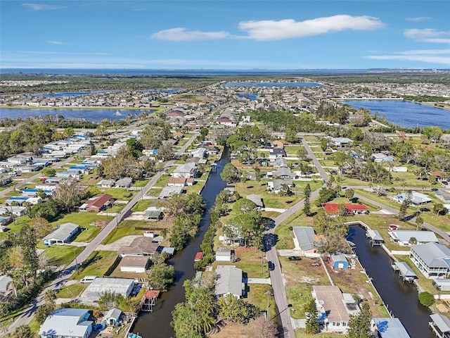 aerial view featuring a residential view and a water view