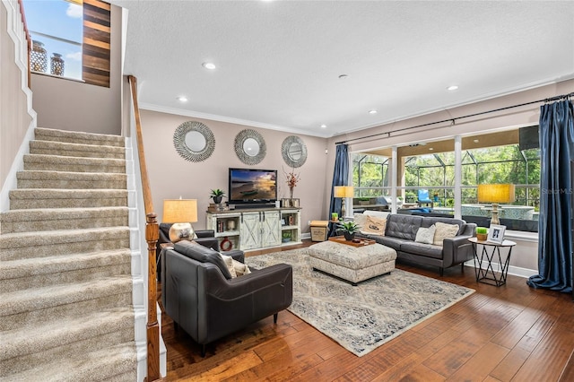 living room with recessed lighting, baseboards, ornamental molding, stairway, and wood-type flooring