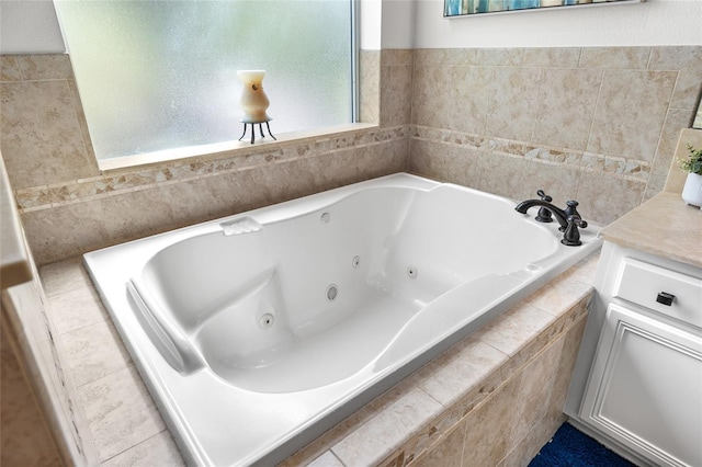 full bathroom featuring vanity and a whirlpool tub