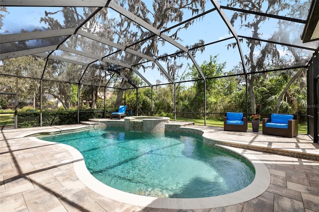 view of pool with a patio area, a pool with connected hot tub, and glass enclosure