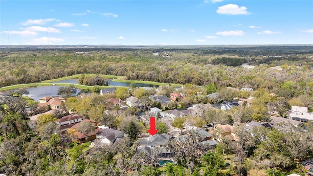 aerial view featuring a water view and a view of trees