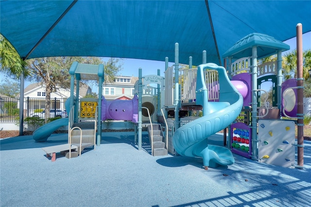 communal playground featuring fence