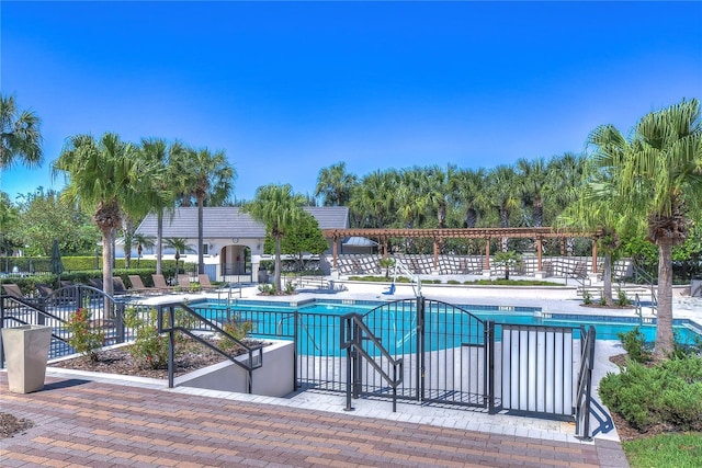 pool featuring a patio and fence