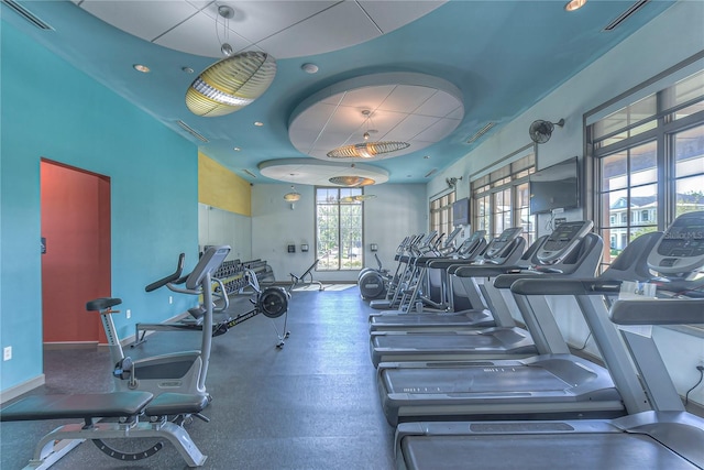 gym featuring baseboards and visible vents