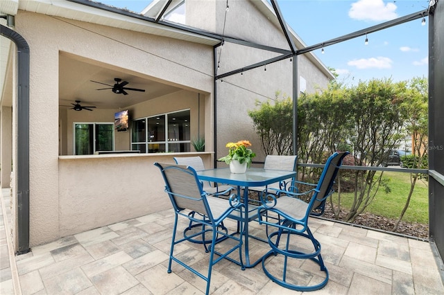 15912 Ternglade Dr, Lithia, FL 33547 - view of patio / terrace with ceiling fan, glass enclosure, and outdoor dining area