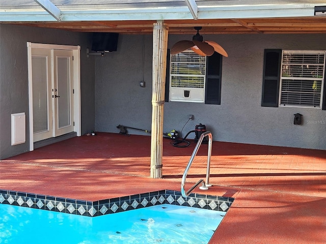 view of pool with ceiling fan