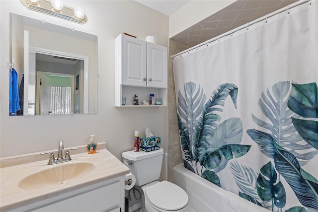 bathroom with toilet, shower / bath combo with shower curtain, and vanity