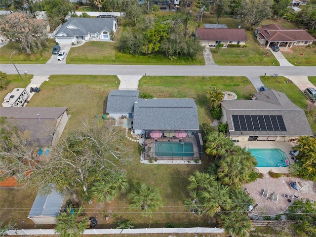 birds eye view of property with a residential view