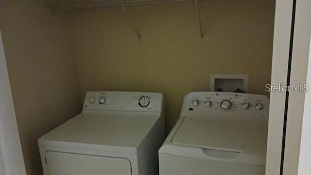 washroom featuring laundry area and independent washer and dryer