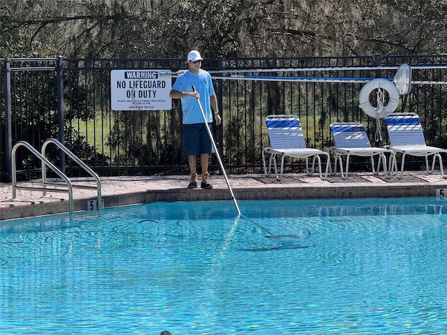 community pool with fence