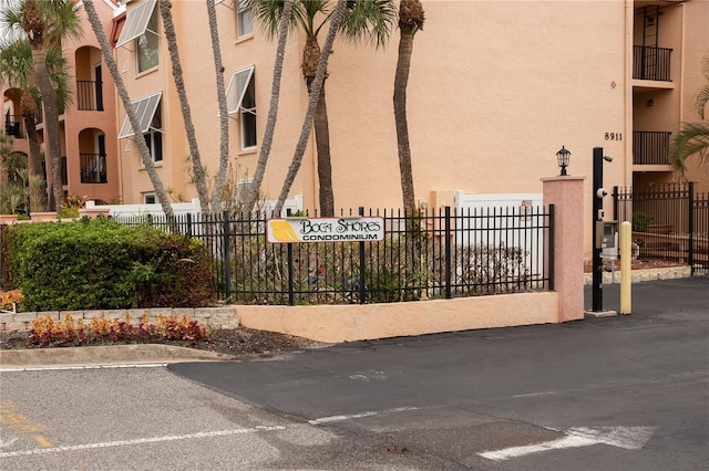 view of property with fence