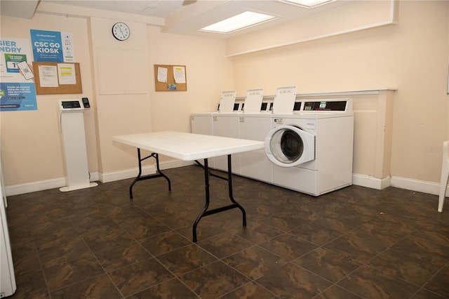 shared laundry area with baseboards and washer and dryer