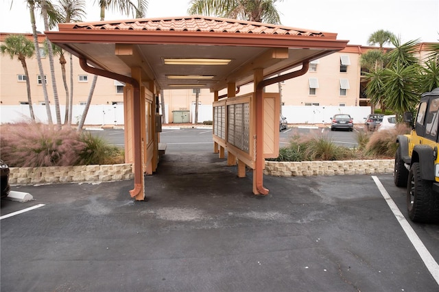 uncovered parking lot featuring mail area