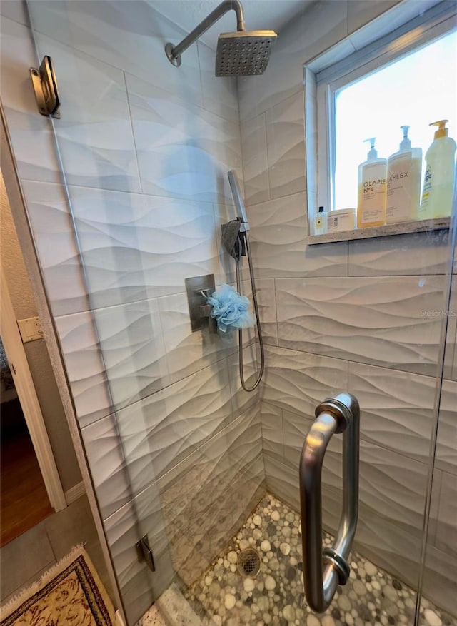 full bathroom featuring a stall shower