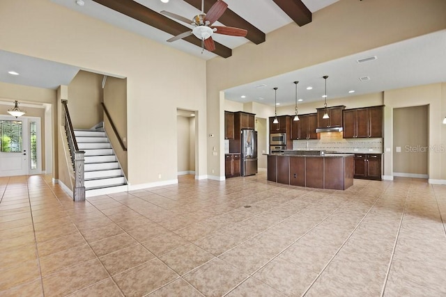 kitchen featuring dark brown cabinetry, visible vents, appliances with stainless steel finishes, and open floor plan