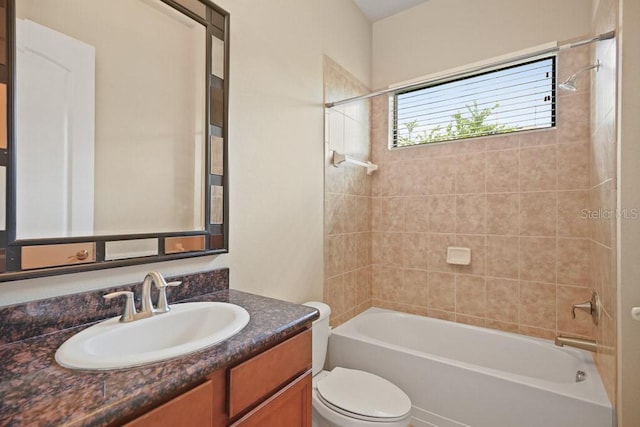 bathroom with vanity, toilet, and bathing tub / shower combination