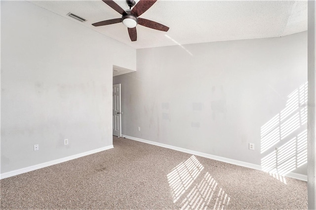 unfurnished room featuring carpet floors, visible vents, and baseboards