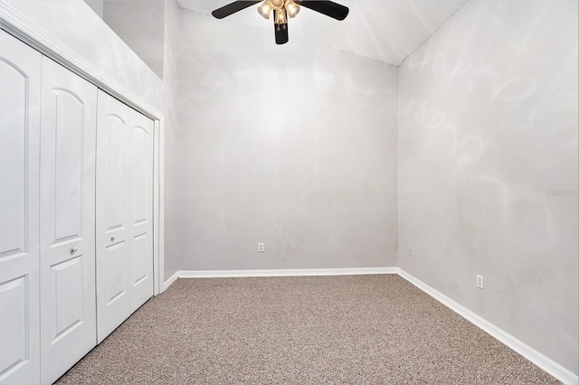 unfurnished bedroom featuring ceiling fan, a closet, baseboards, and carpet flooring