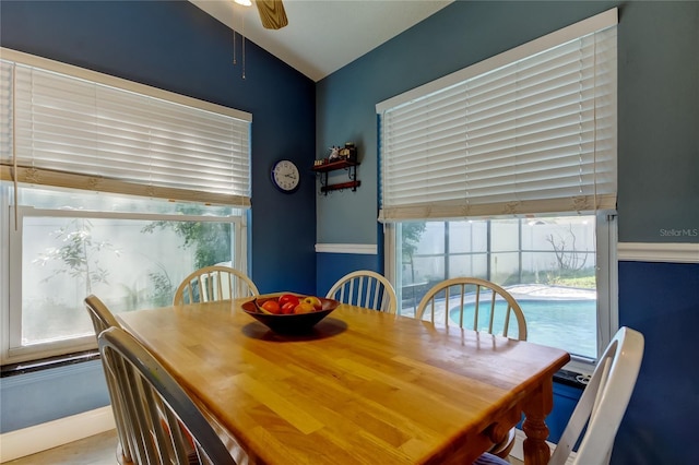 dining room featuring lofted ceiling, ceiling fan, and a wealth of natural light