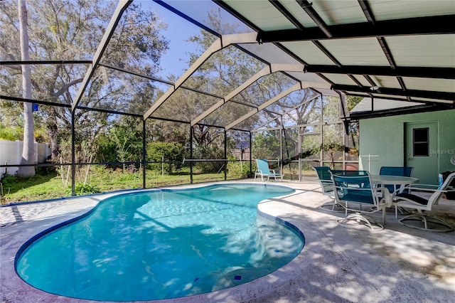 view of swimming pool with a fenced in pool, a lanai, a patio, and fence