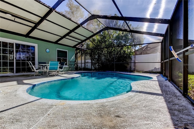 pool with a patio area and a lanai