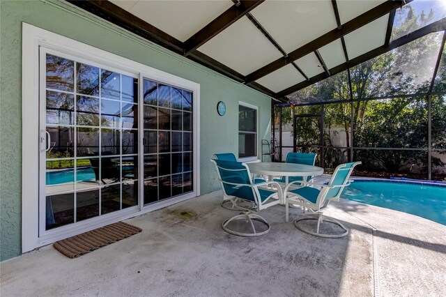 sunroom / solarium with vaulted ceiling