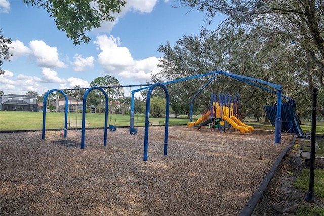 community jungle gym featuring a yard