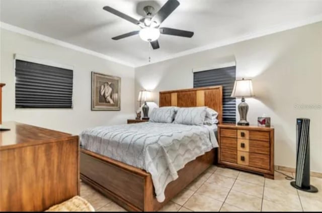 bedroom with light tile patterned flooring, a ceiling fan, and crown molding