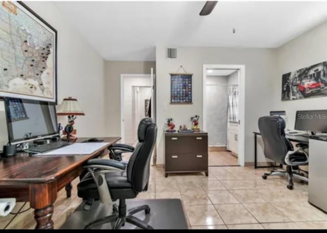 office with light tile patterned flooring and baseboards