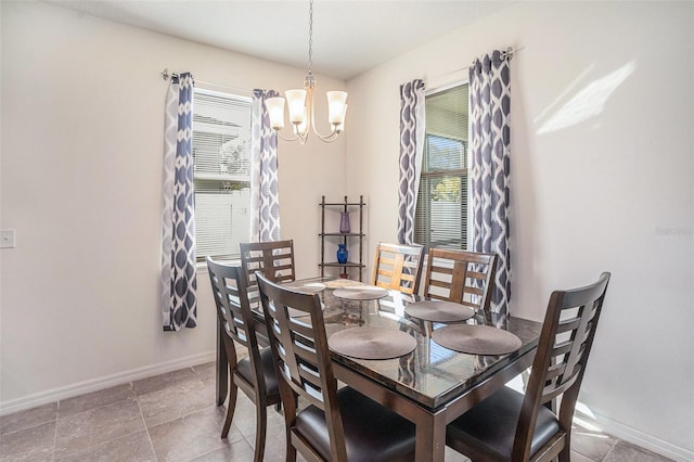 10604 Scenic Hollow Dr, Riverview, FL 33578 - dining room featuring baseboards and a notable chandelier
