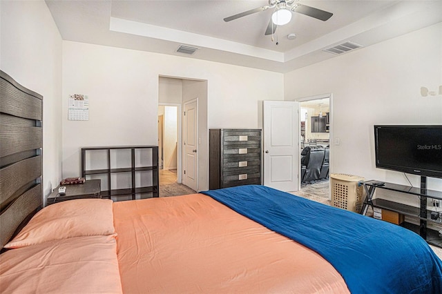 10604 Scenic Hollow Dr, Riverview, FL 33578 - bedroom with a raised ceiling, visible vents, and ceiling fan