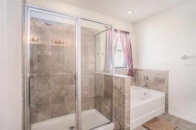 10604 Scenic Hollow Dr, Riverview, FL 33578 - bathroom featuring a stall shower, baseboards, and a bath