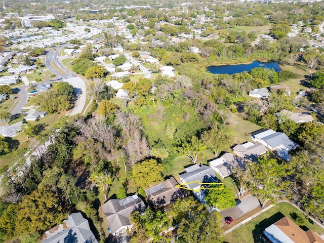 drone / aerial view with a water view and a residential view