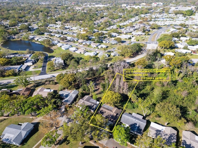 aerial view with a residential view and a water view