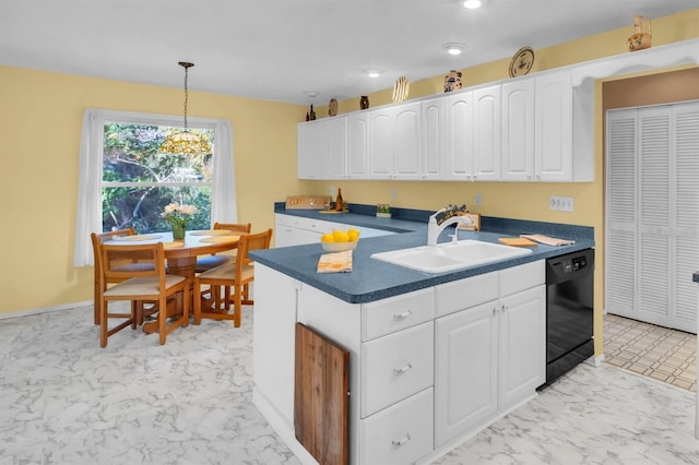 kitchen featuring dark countertops, black dishwasher, marble finish floor, white cabinetry, and a sink