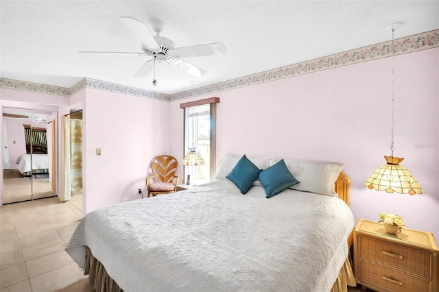 bedroom with light tile patterned floors and a ceiling fan