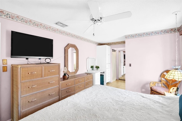 bedroom featuring visible vents and ceiling fan