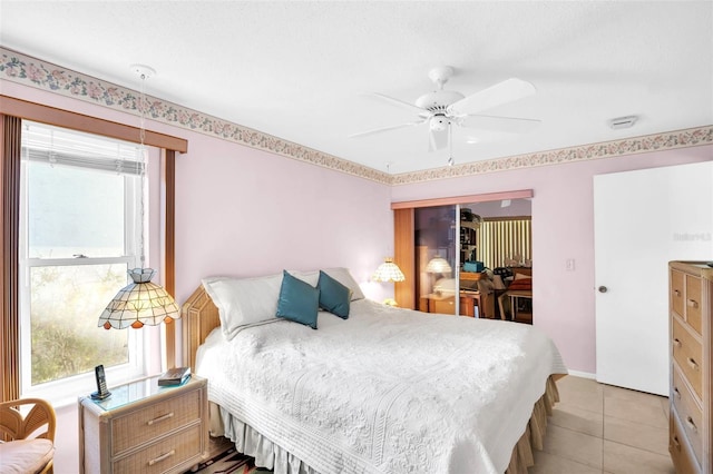 bedroom with light tile patterned flooring and a ceiling fan