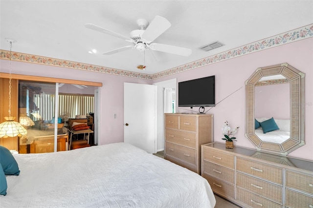 bedroom with a closet, visible vents, and ceiling fan