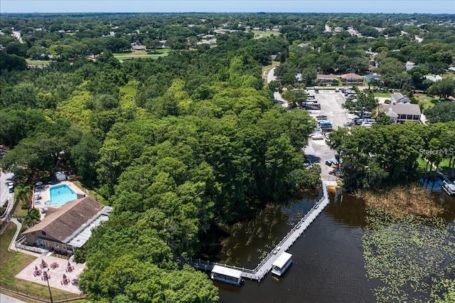 aerial view with a wooded view and a water view