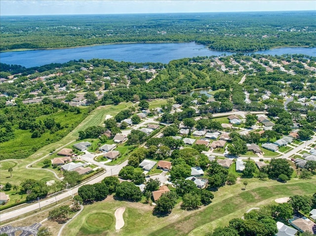 birds eye view of property featuring a residential view, a water view, and a wooded view