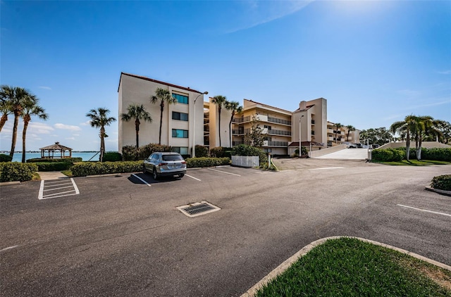 view of property featuring uncovered parking