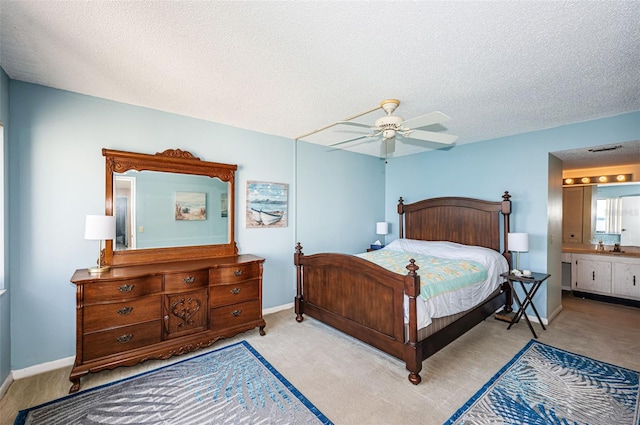 bedroom featuring carpet floors, a textured ceiling, and baseboards