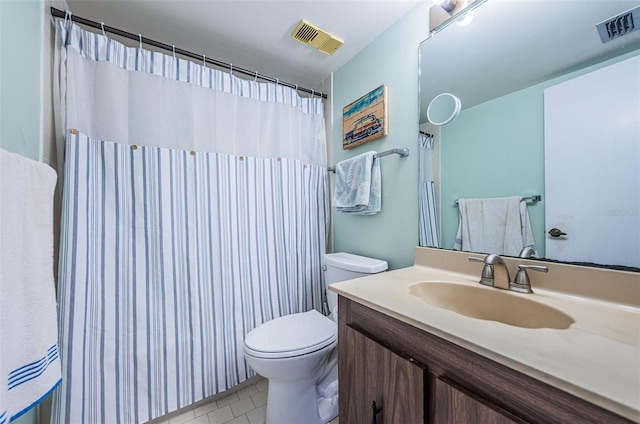 full bathroom featuring tile patterned flooring, visible vents, vanity, and toilet