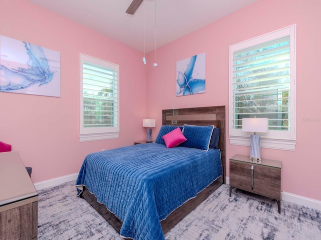 bedroom featuring baseboards and a ceiling fan