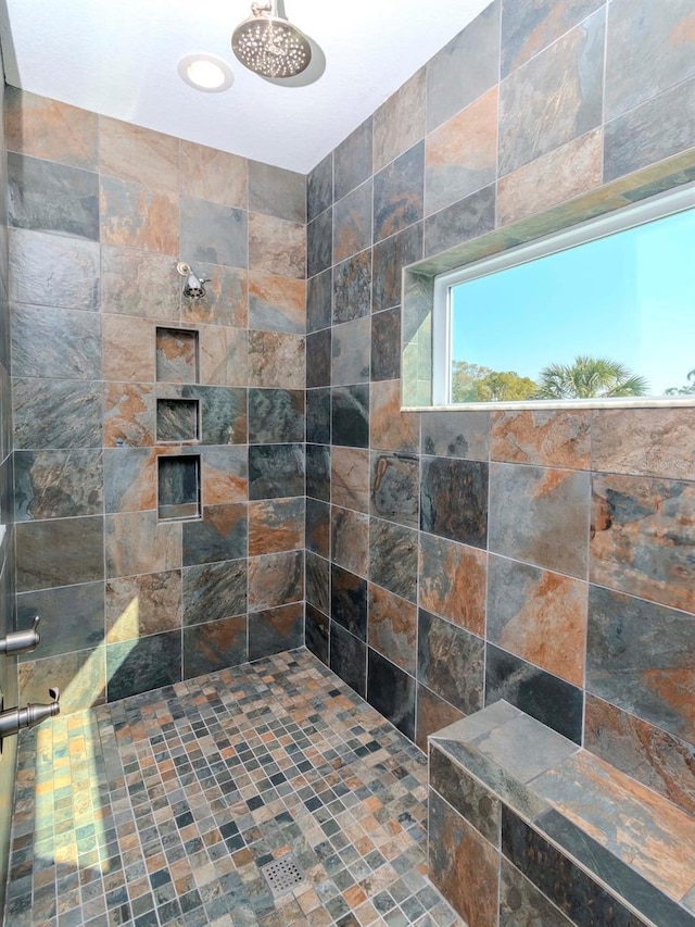 full bathroom featuring a tile shower