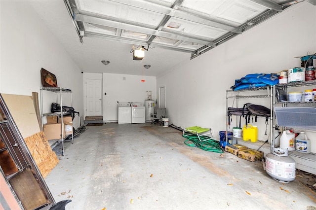 garage with a garage door opener, washer and dryer, and water heater