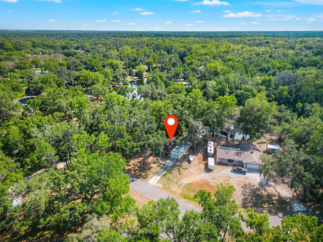 birds eye view of property with a wooded view